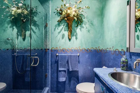 a bathroom with a toilet sink and tub