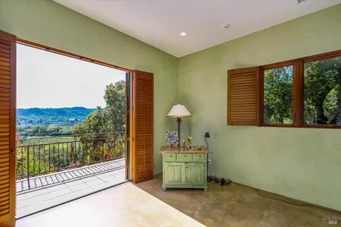 a room with furniture and a large window