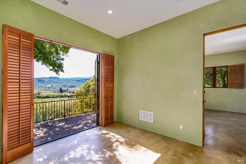 a view of a back yard from a patio