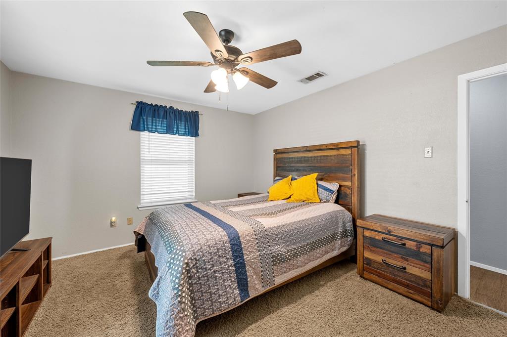 1038 South Old Robinson Road Robinson, TX 76706 - Photo 13 of 36 Bedroom with ceiling fan and light colored carpet