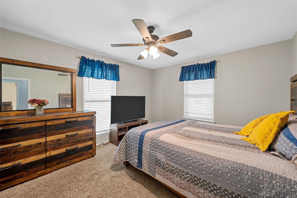 1038 South Old Robinson Road Robinson, TX 76706 - Photo 14 of 36 Bedroom with carpet floors and a ceiling fan