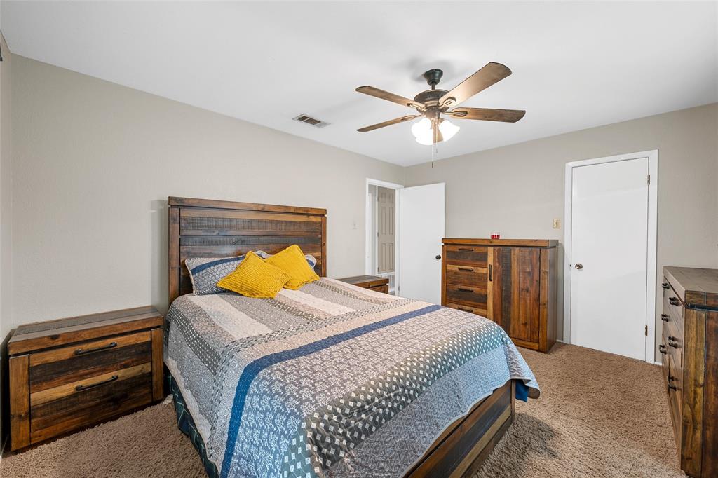1038 South Old Robinson Road Robinson, TX 76706 - Photo 15 of 36 Bedroom featuring light carpet and ceiling fan