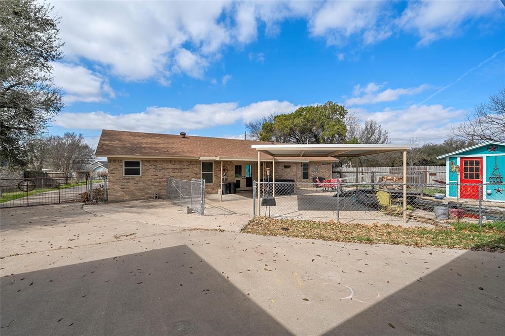 1038 South Old Robinson Road Robinson, TX 76706 - Photo 22 of 36 View of front of house featuring a patio, brick siding, concrete driveway, a gate, and a carport