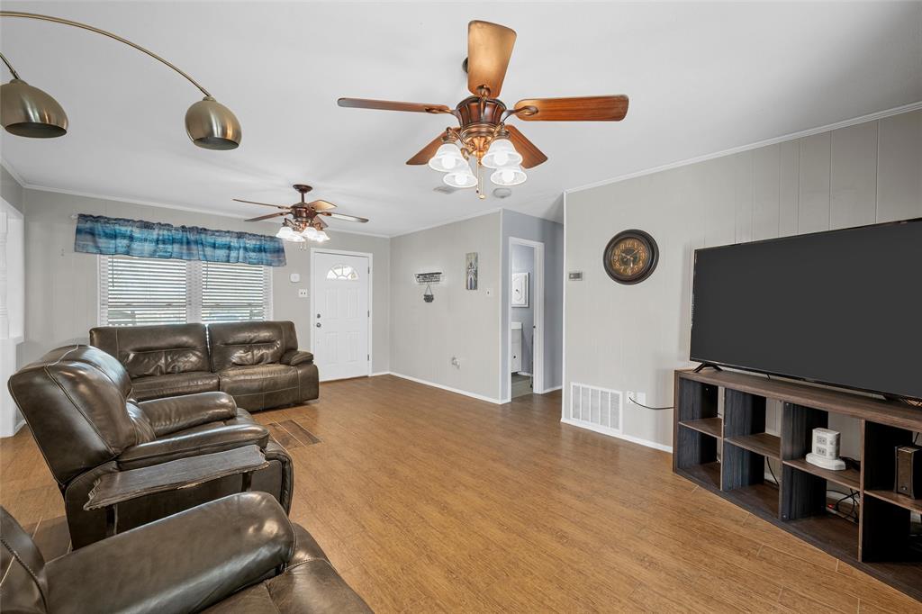 1038 South Old Robinson Road Robinson, TX 76706 - Photo 4 of 36 Living area with light wood finished floors, ceiling fan, and ornamental molding