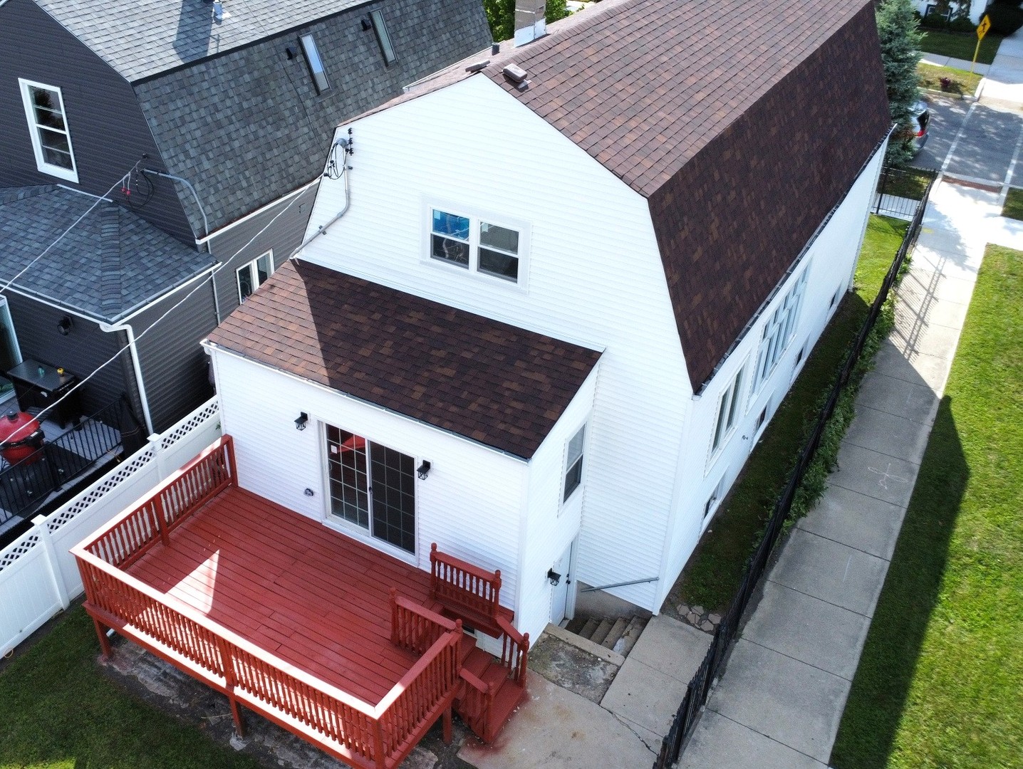 5657 North Parkside Avenue Chicago, IL 60646 - Photo 2 of 29 a roof deck with a couch and potted plants