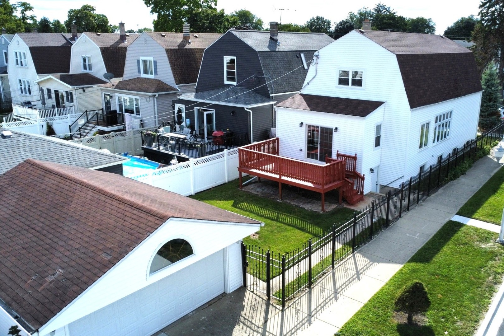 5657 North Parkside Avenue Chicago, IL 60646 - Photo 28 of 29 a aerial view of a house with swimming pool and furniture