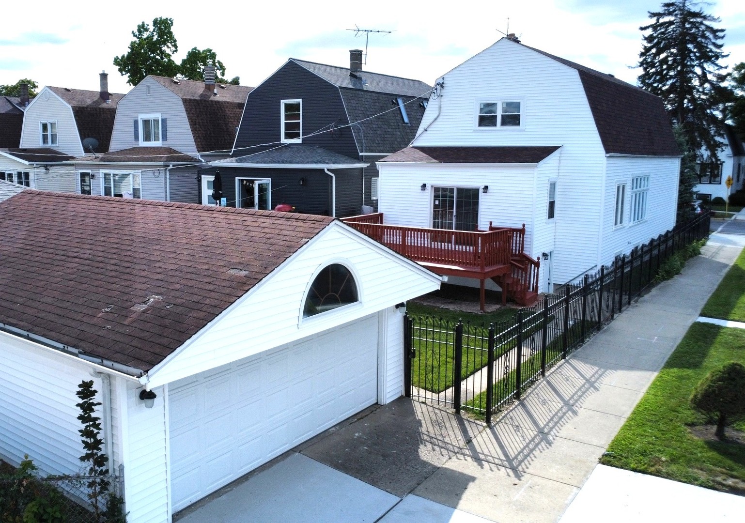 5657 North Parkside Avenue Chicago, IL 60646 - Photo 29 of 29 a front view of a house with a yard