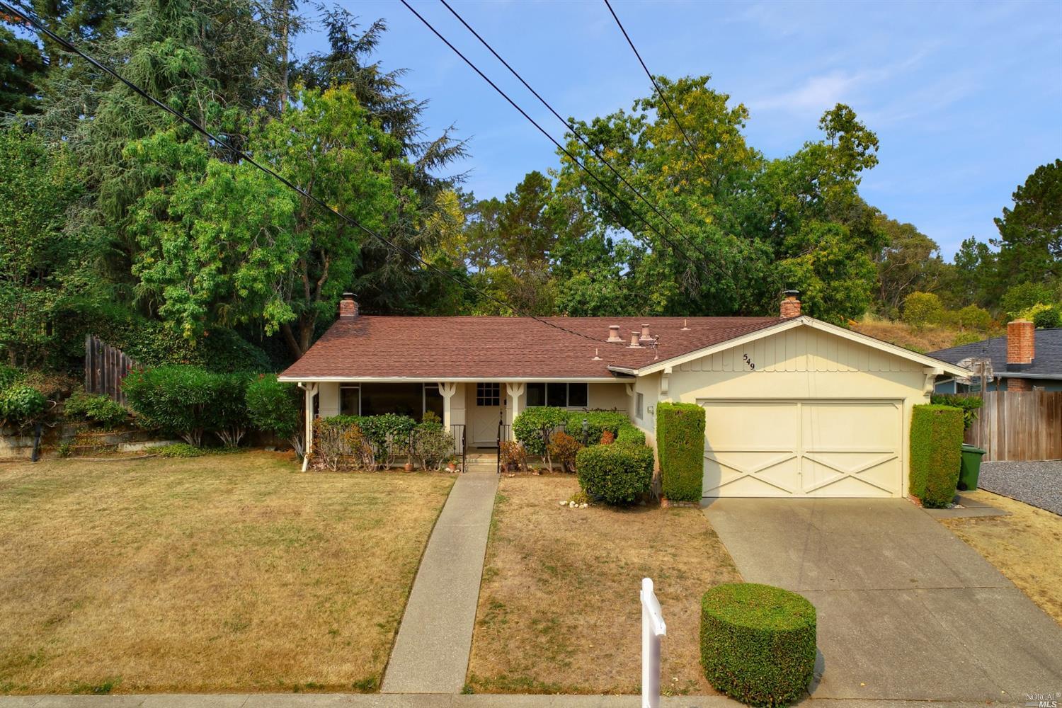 549 Montecillo Road San Rafael, CA 94903 - Photo 1 of 1 a front view of a house with a garden