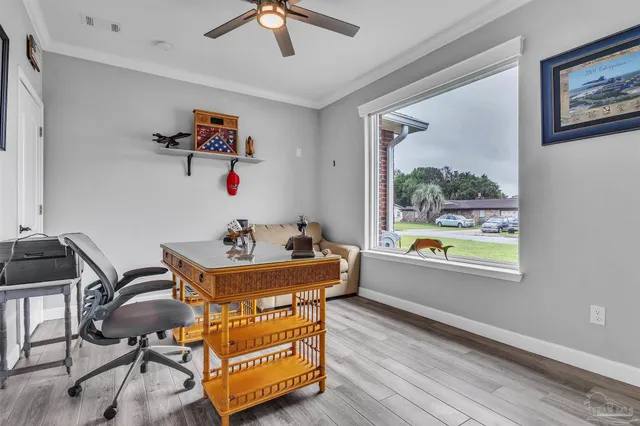 a bedroom with furniture and a window