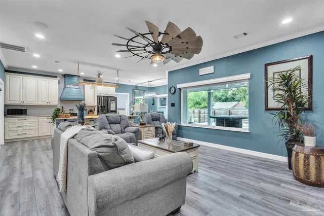 a living room with furniture or window and a wooden floor