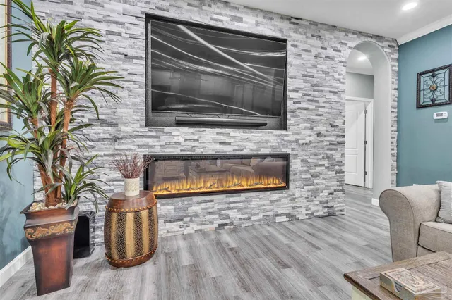 a living room with furniture and a fireplace