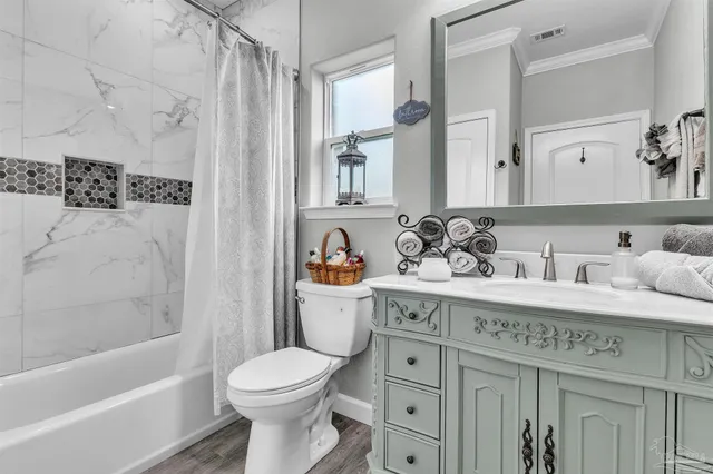 a bathroom with a sink a toilet and a bathtub
