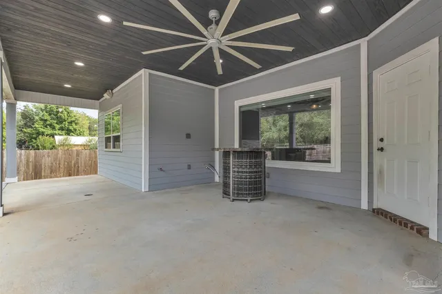 a view of a house with a backyard