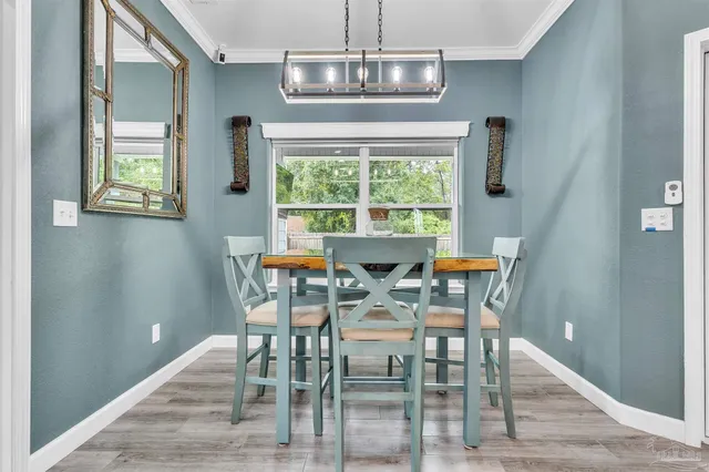 a view of a dining room with furniture window and outside view