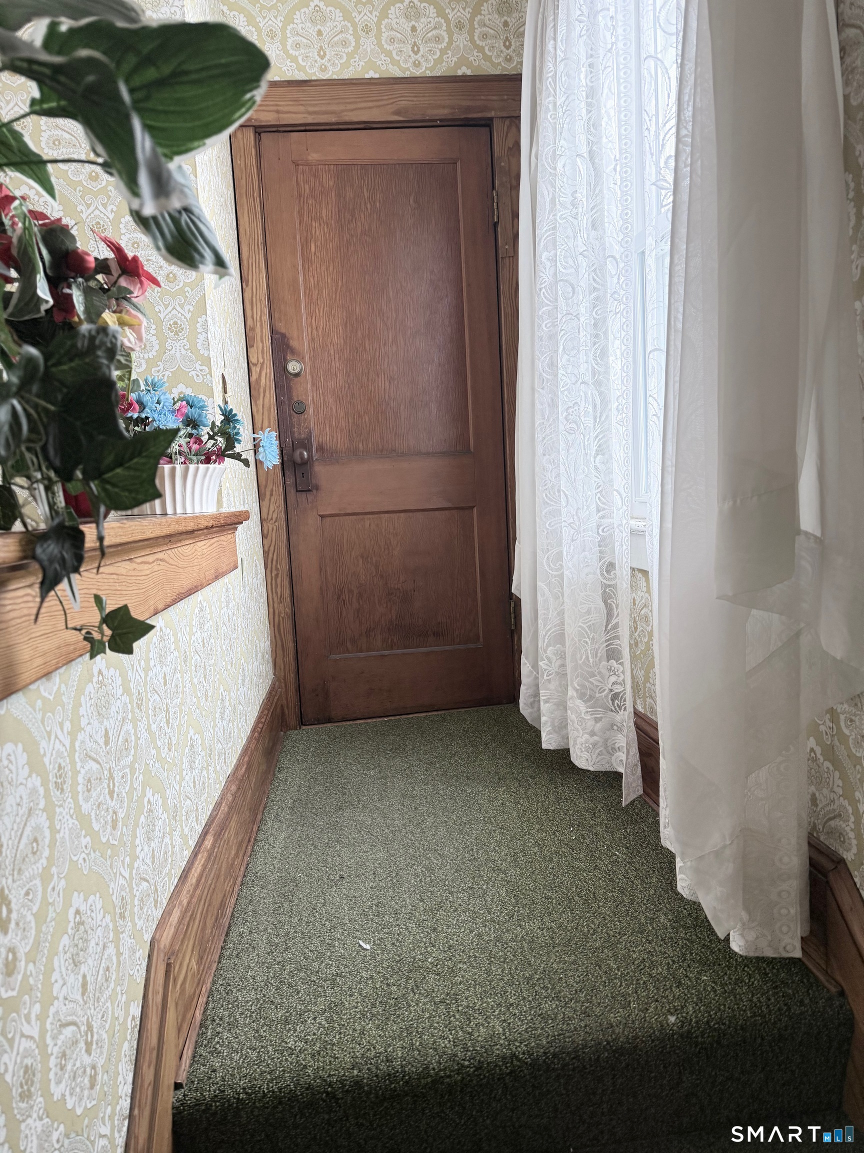 72 Brainard Street New London, CT 06320 - Photo 4 of 11 a view of a room with door