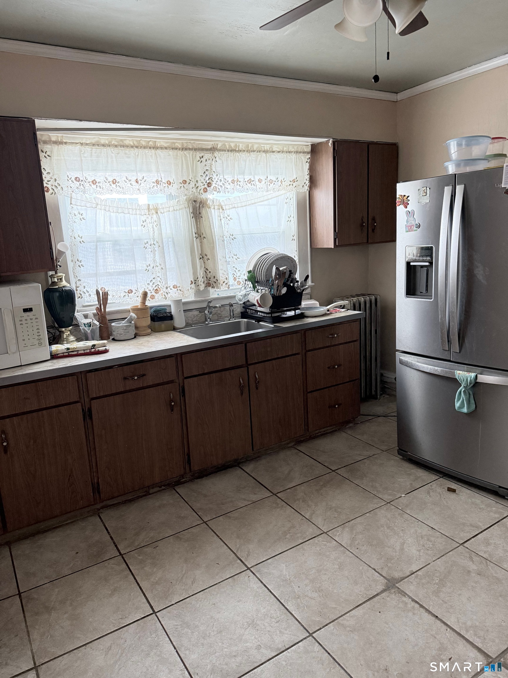 72 Brainard Street New London, CT 06320 - Photo 7 of 11 a kitchen with stainless steel appliances granite countertop a sink stove and refrigerator