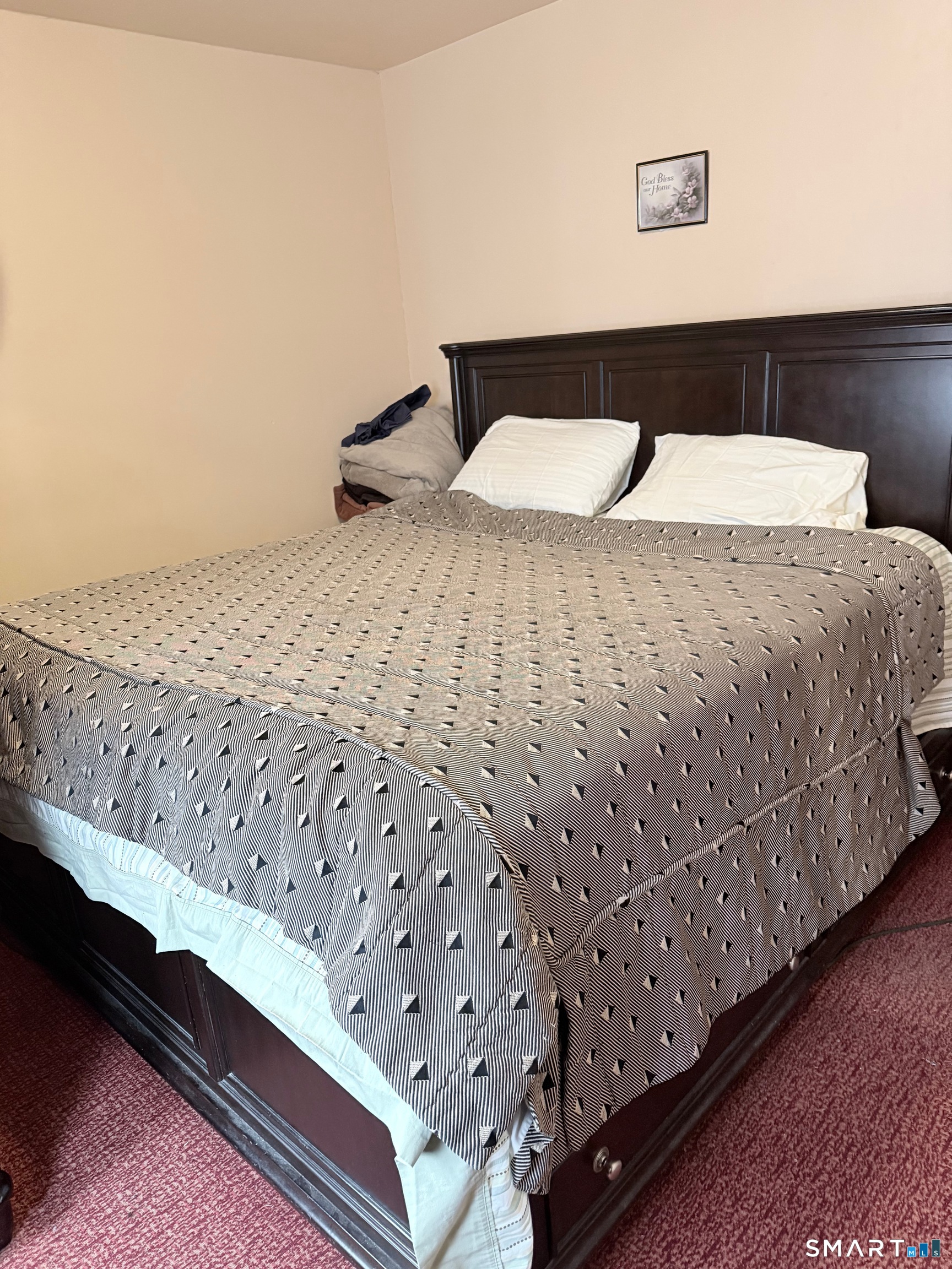 72 Brainard Street New London, CT 06320 - Photo 9 of 11 a bedroom with a bed and wooden floor