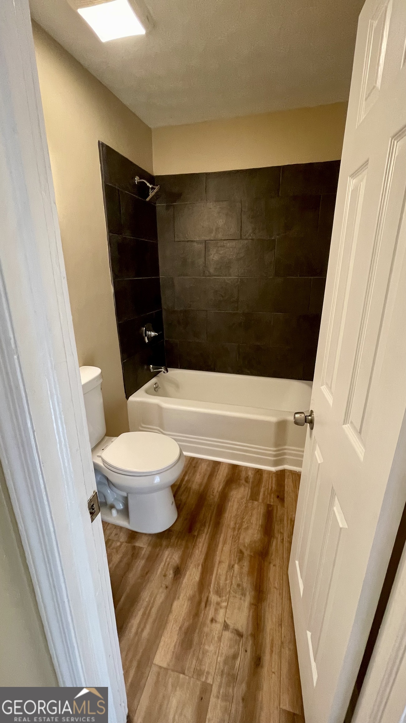 611 West Moore Street Dublin, GA 31021 - Photo 14 of 15 a bathroom with a toilet and a shower