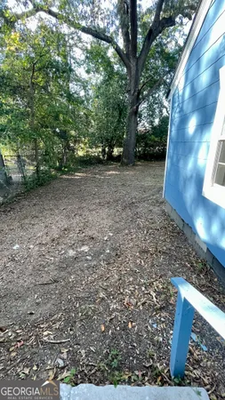 a view of outdoor space with deck and yard