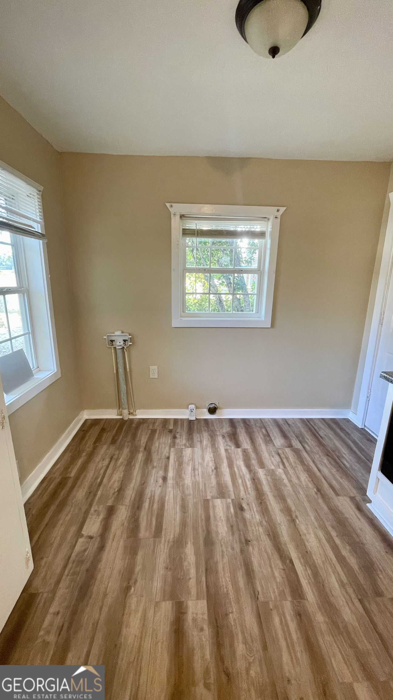 611 West Moore Street Dublin, GA 31021 - Photo 7 of 15 a view of an empty room and window