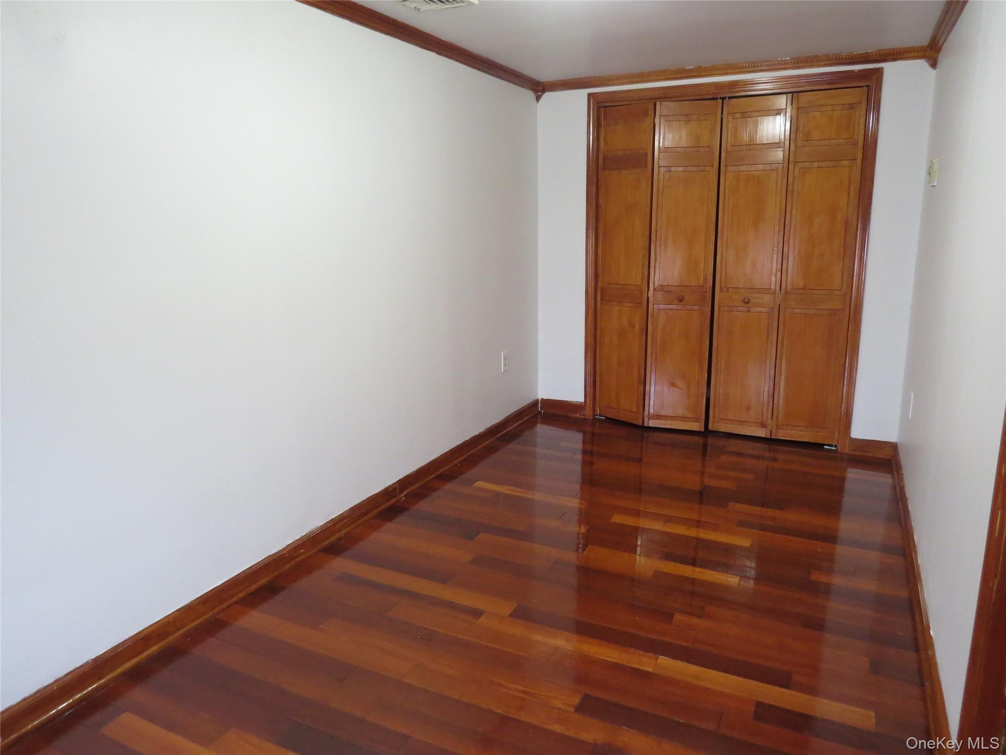 2 East Main Street, Unit 4 Middletown, NY 10940 - Photo 6 of 10 a view of room with window and hardwood floor