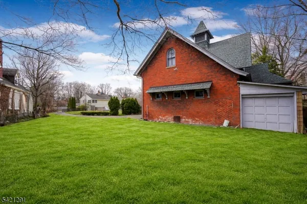 a front view of house with backyard