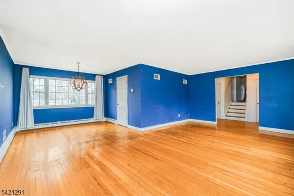 a view of a livingroom with furniture and a fireplace