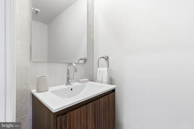 a living room with fireplace furniture and a chandelier