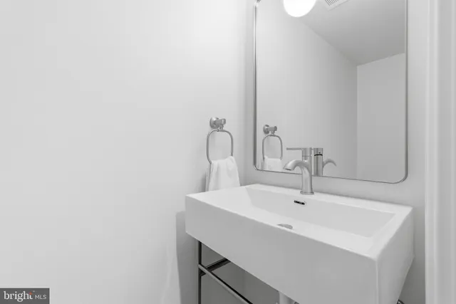 a bathroom with a shower and a sink