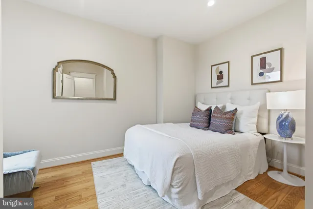 a view of a workspace with furniture and wooden floor