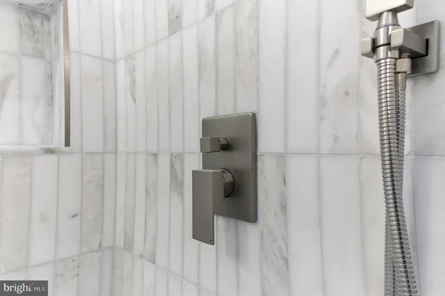 a living room with furniture and stairs