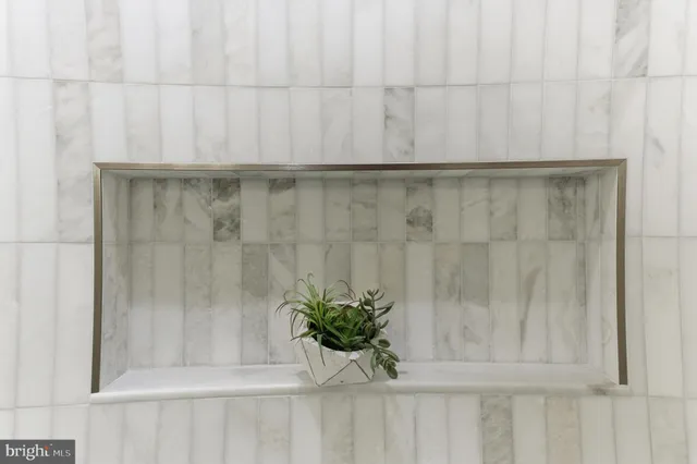 a front view of a house with a black and white door