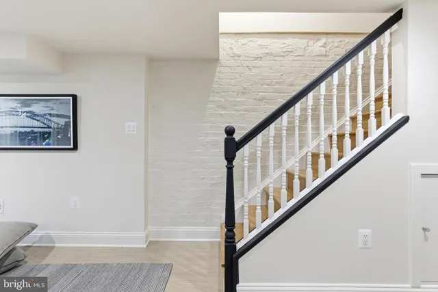 a bedroom with a bed and a chair