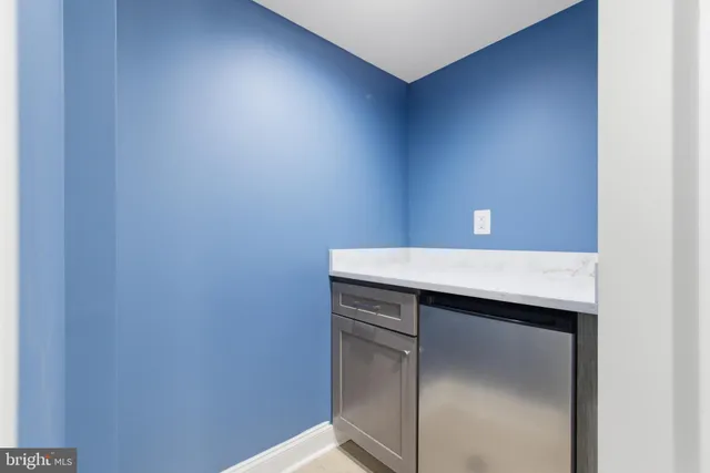 a view of a house with a door and wooden floor
