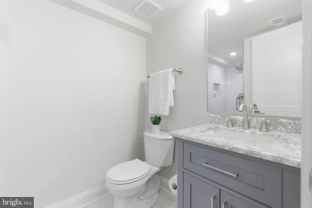 a view of a brick house with a large window