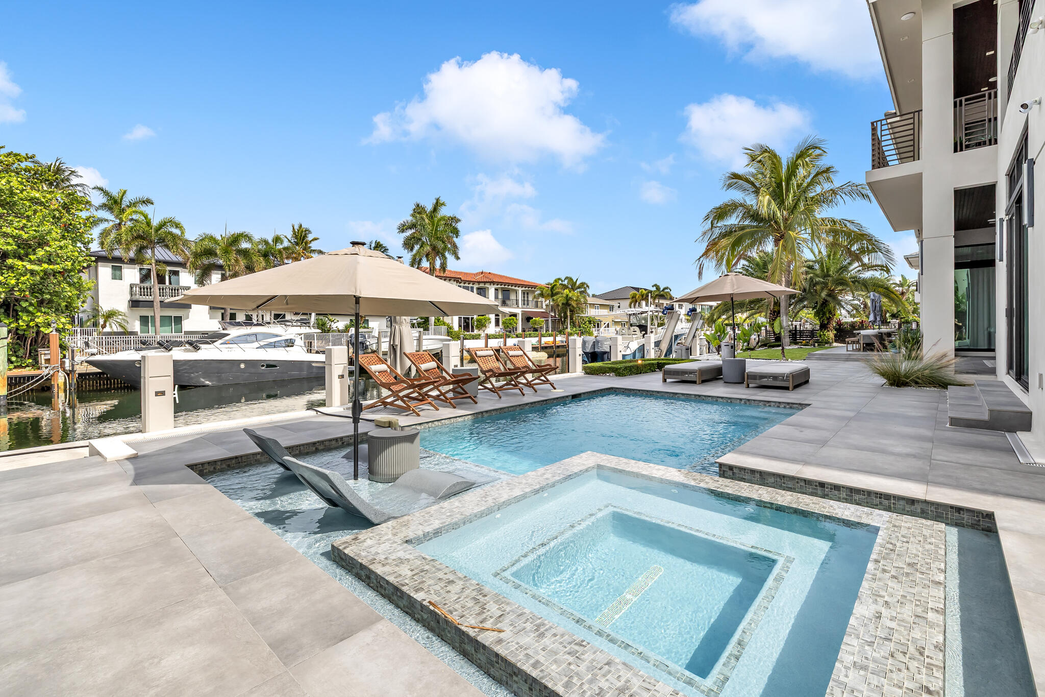 3711 Northeast 30th Avenue Lighthouse Point, FL 33064 - Photo 31 of 57 a view of a swimming pool with sitting area