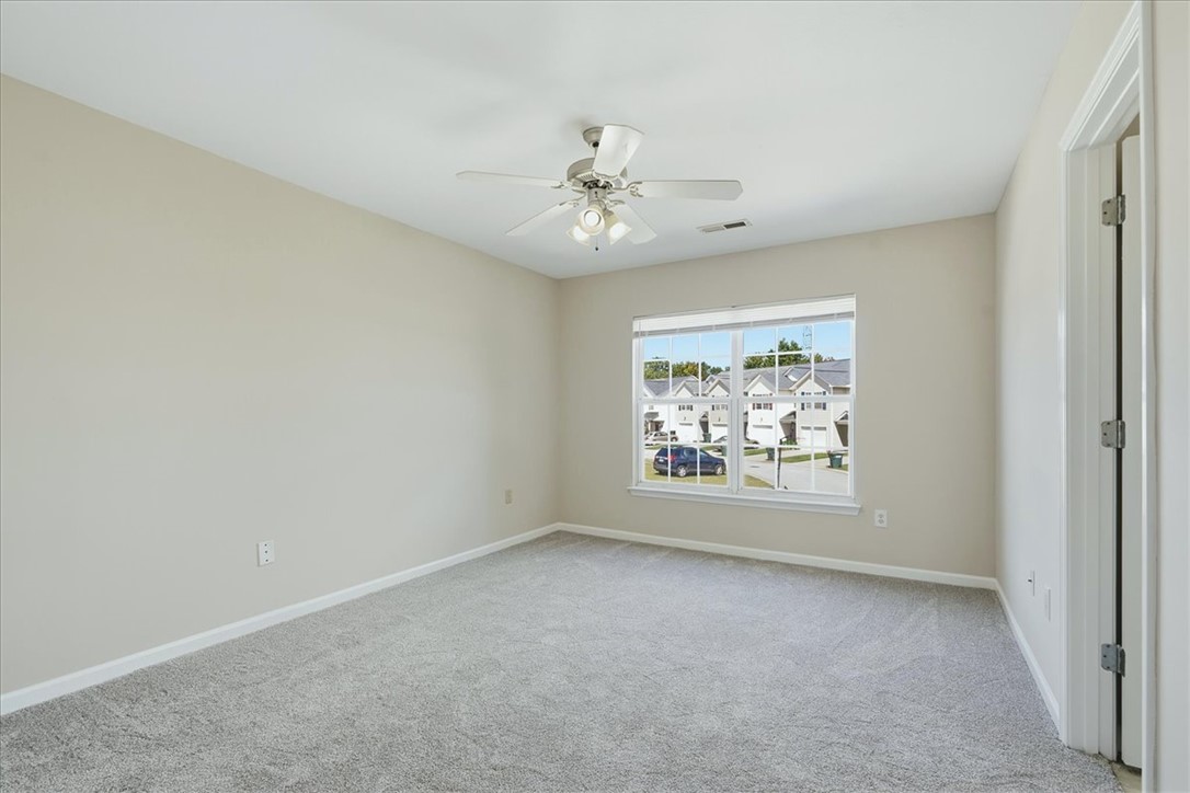 703 Bellview Way Seneca, SC 29678 - Photo 18 of 23 Plentiful natural light streams through a large window illuminating this carpeted bedroom.