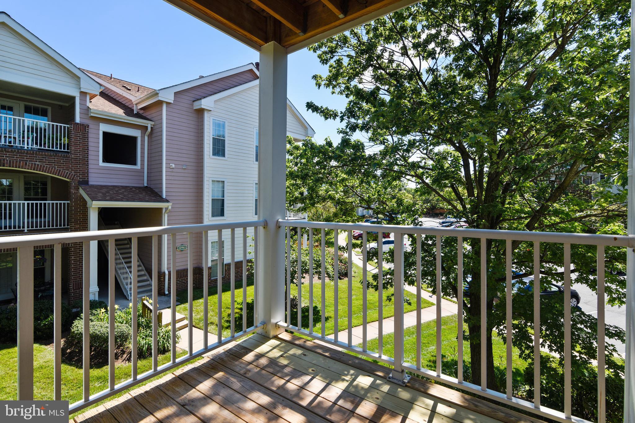 20991 Timber Ridge Terrace, Unit 204 Ashburn, VA 20147 - Photo 15 of 52 View From The Balcony Off The Dining Room