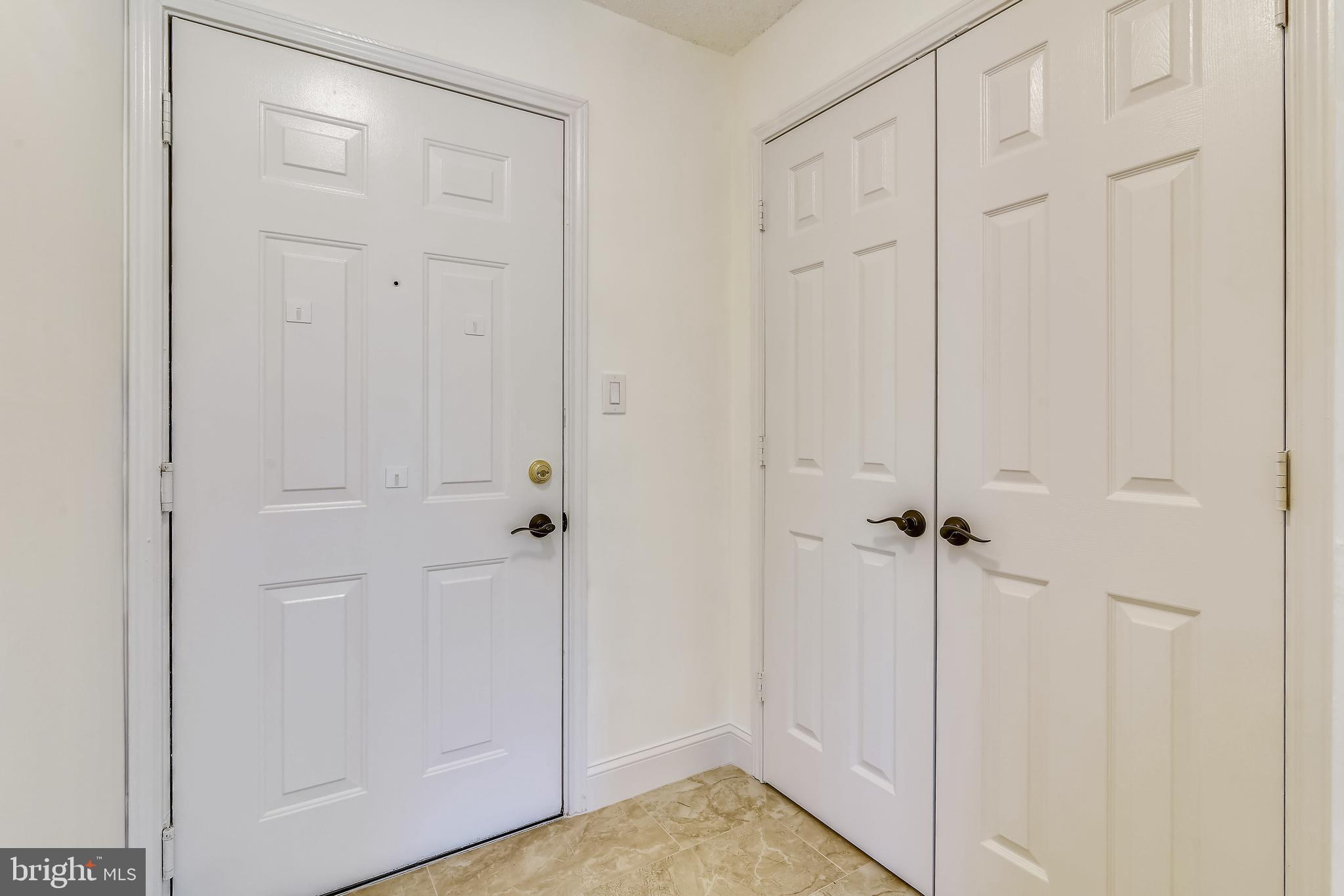 20991 Timber Ridge Terrace, Unit 204 Ashburn, VA 20147 - Photo 24 of 52 Entry and Hall Closet
