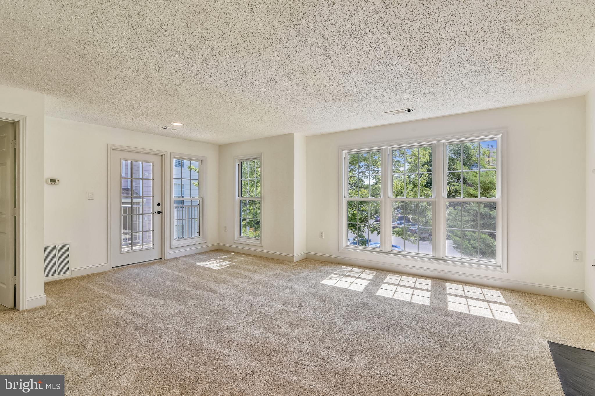 20991 Timber Ridge Terrace, Unit 204 Ashburn, VA 20147 - Photo 33 of 52 Dining Area and French Door To Outdoor Balcony
