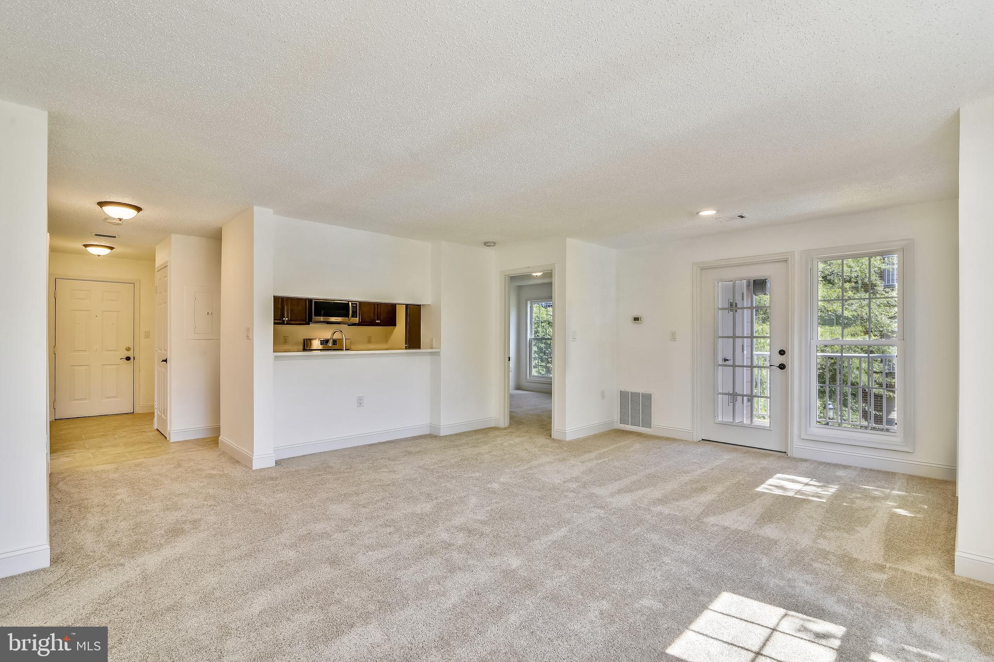 20991 Timber Ridge Terrace, Unit 204 Ashburn, VA 20147 - Photo 34 of 52 Living Room /Dining Room