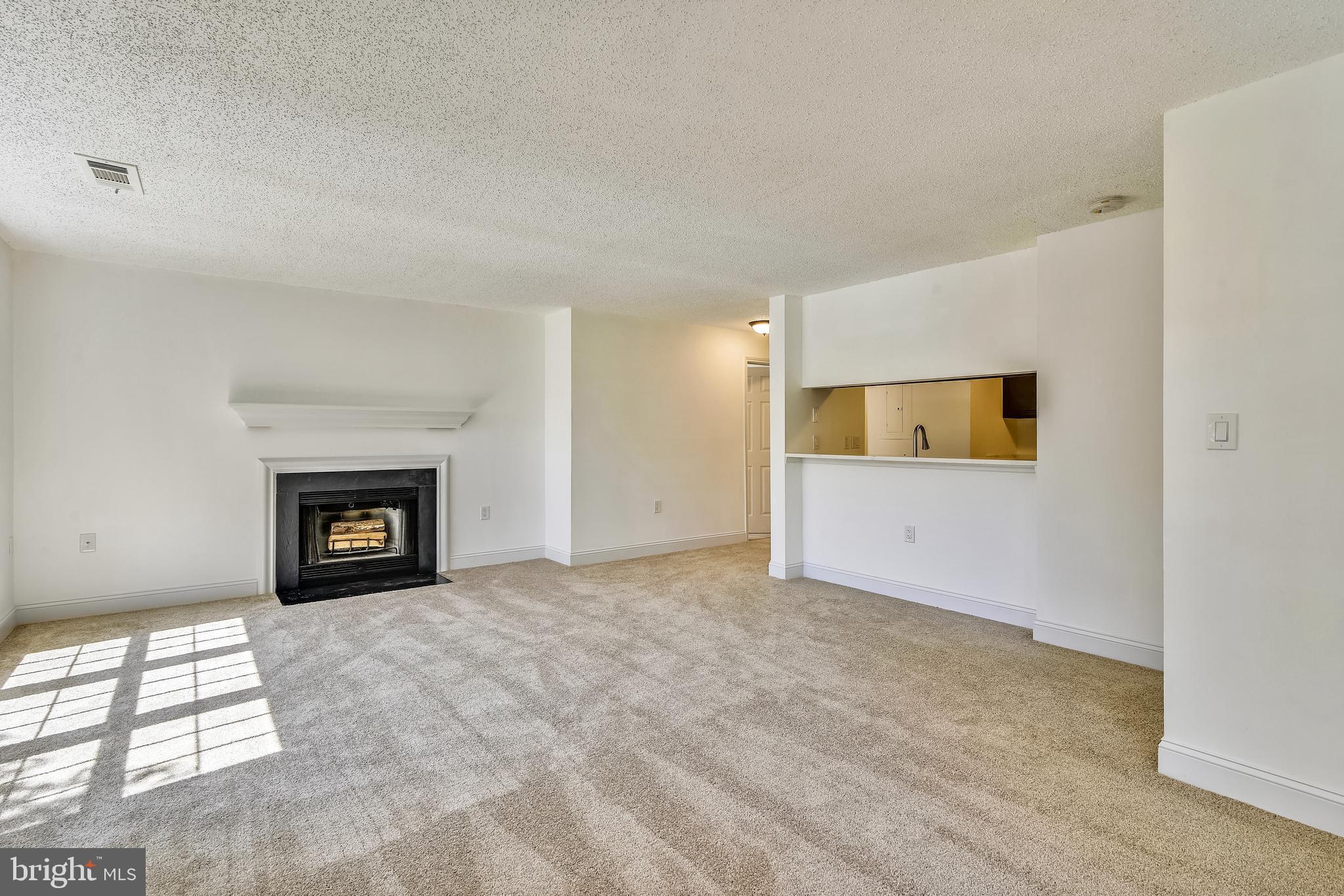 20991 Timber Ridge Terrace, Unit 204 Ashburn, VA 20147 - Photo 35 of 52 Living Room/Dining Room