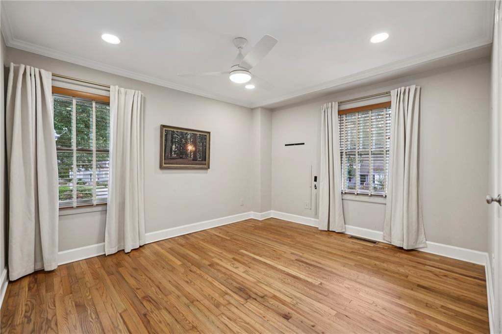 1952 Wingate Road Chamblee, GA 30341 - Photo 11 of 23 a view of an empty room with wooden floor and a window
