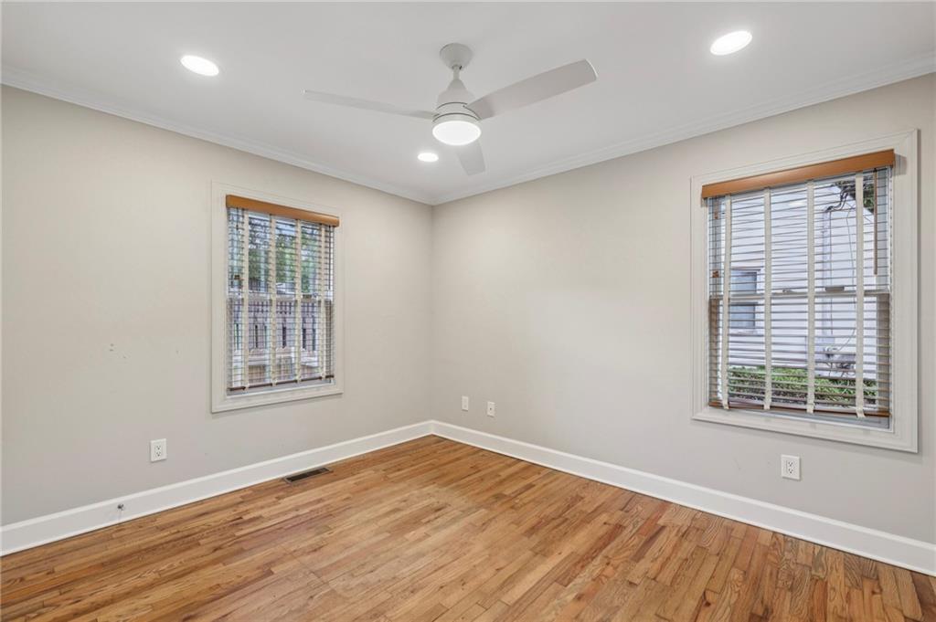 1952 Wingate Road Chamblee, GA 30341 - Photo 15 of 23 an empty room with wooden floor and windows
