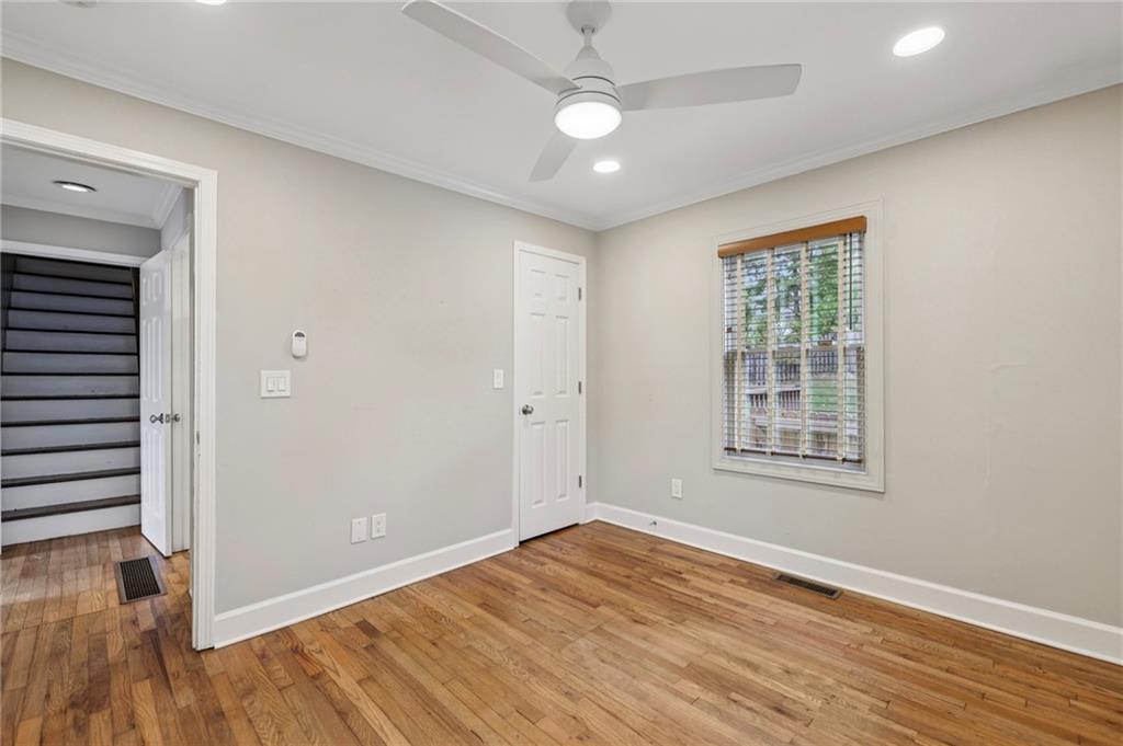 1952 Wingate Road Chamblee, GA 30341 - Photo 16 of 23 an empty room with wooden floor and windows