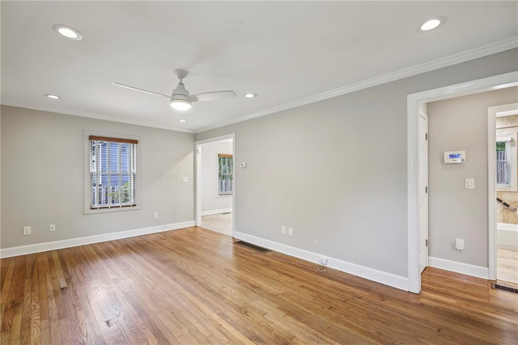 1952 Wingate Road Chamblee, GA 30341 - Photo 4 of 23 a view of an empty room with wooden floor and a window