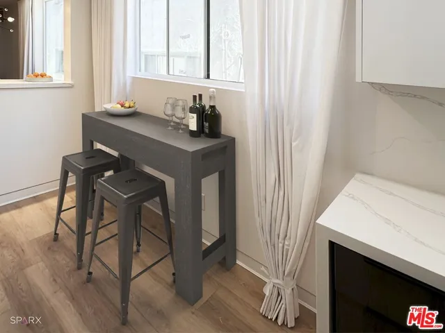 a bathroom with a sink a mirror and a window