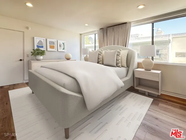 a large white bed in a hotel room