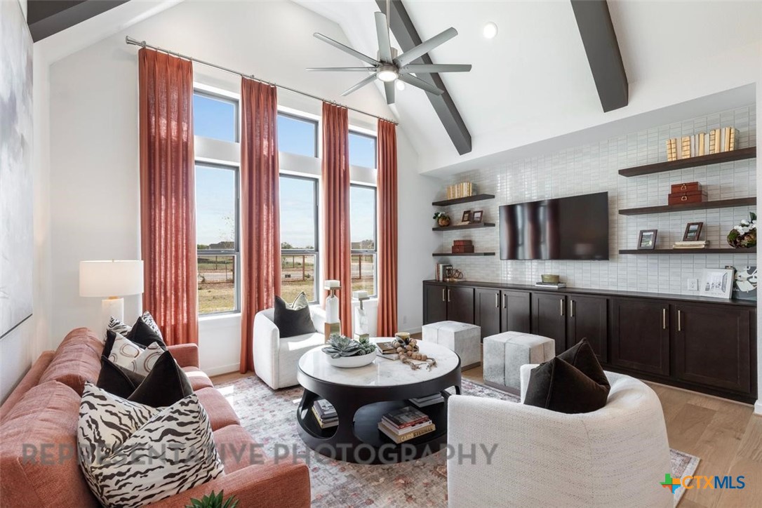 9501 Boathouse Drive Austin, TX 78744 - Photo 3 of 32 a living room with furniture and a large window
