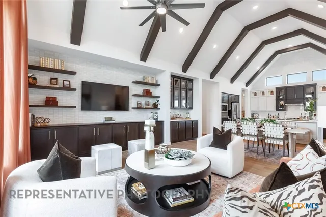 a kitchen with a refrigerator a stove top oven a sink and dishwasher